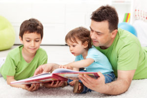 © Ilona75 | Dreamstime.com - Reading Time With Father Photo