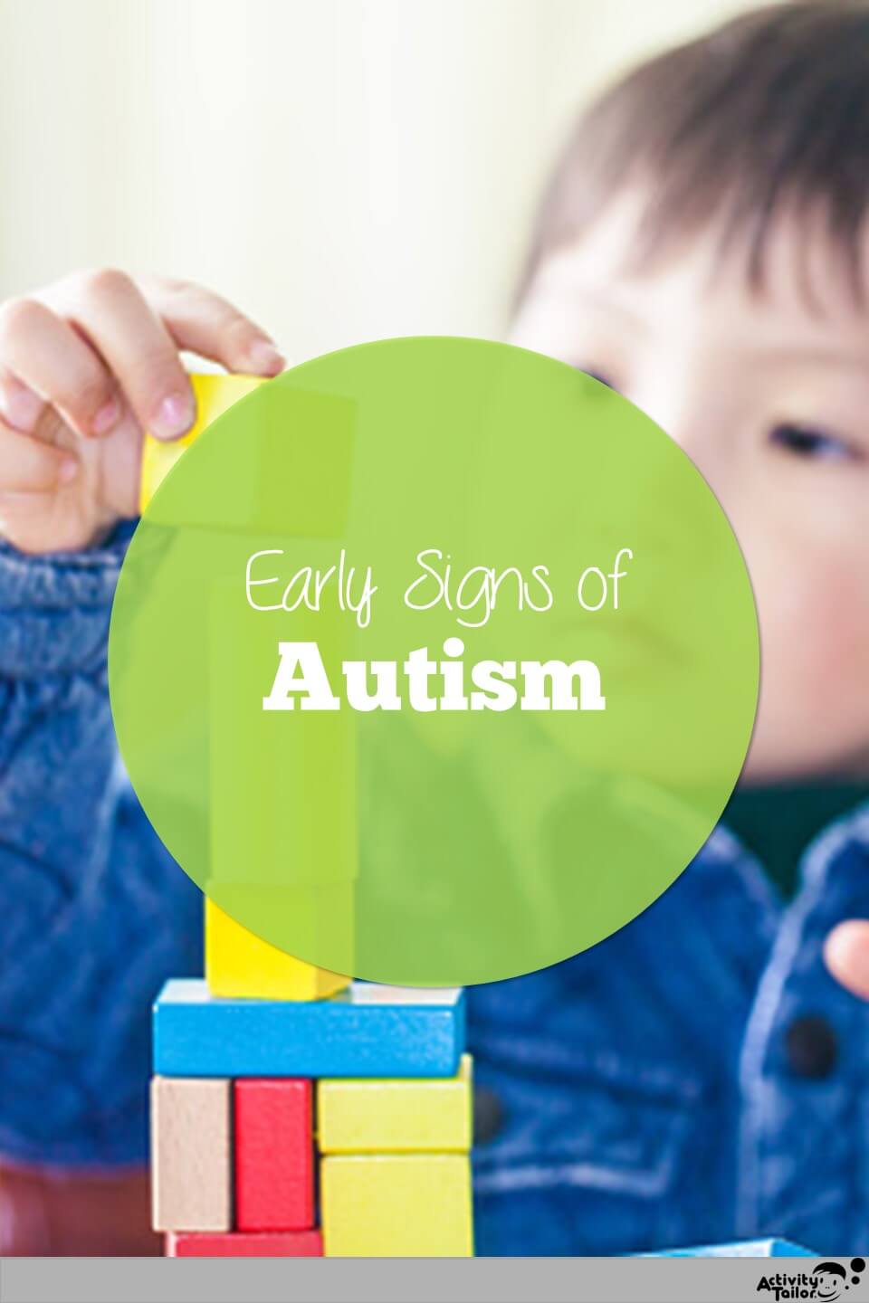 young boy with autism building with blocks